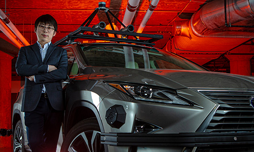 Engineering assistant professor Jiaqi Ma shows off this driverless Lexus in UC’s 1819 Innovation Hub.