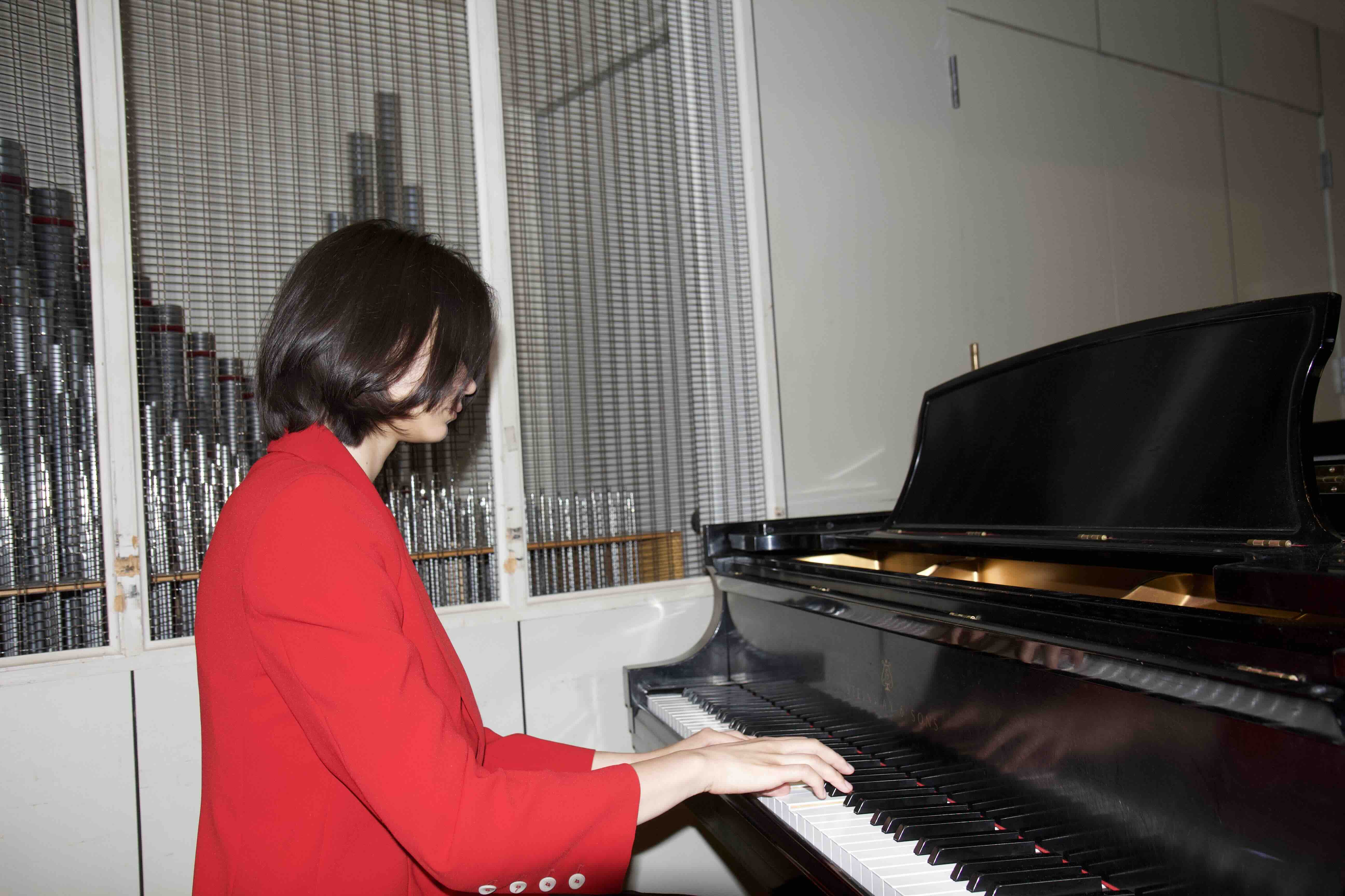 Trinity playing piano