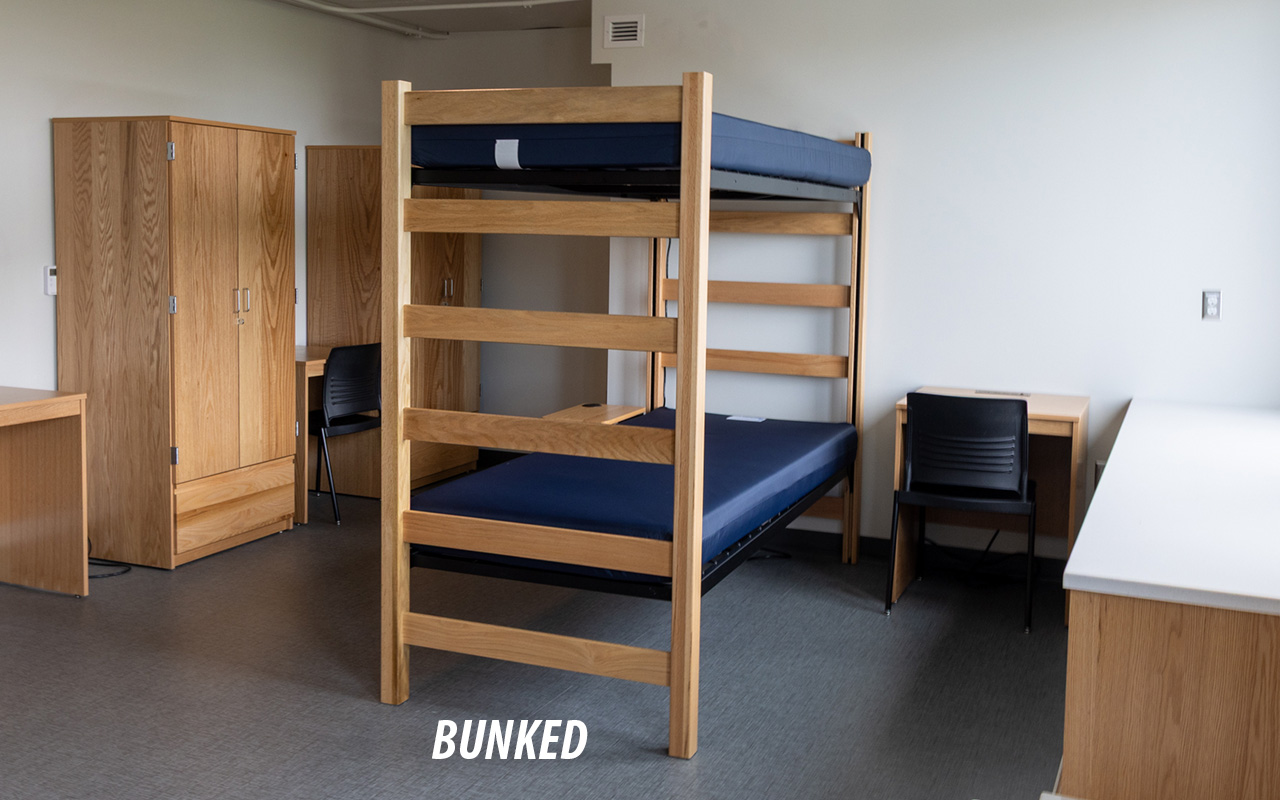 Residence hall room showing two beds bunked
