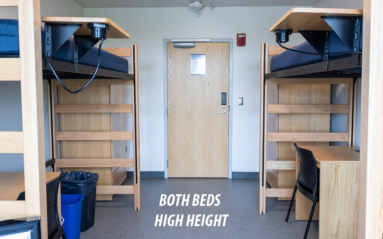 A residence room showing two beds at high height.