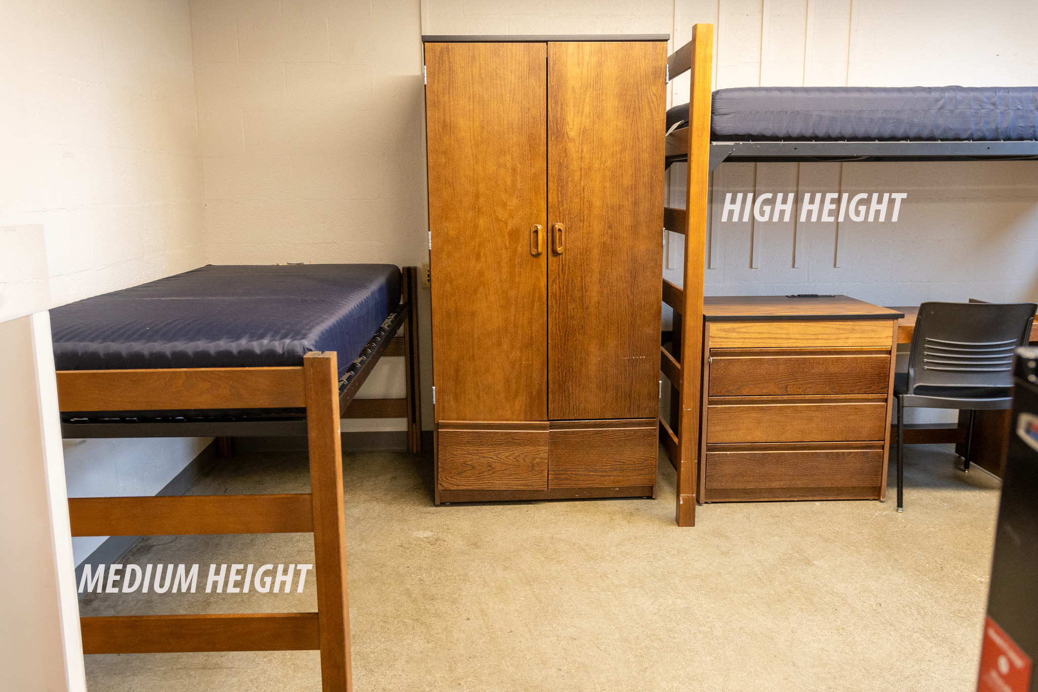 A residence hall medium bed height next to a high height with a wardrobe between them