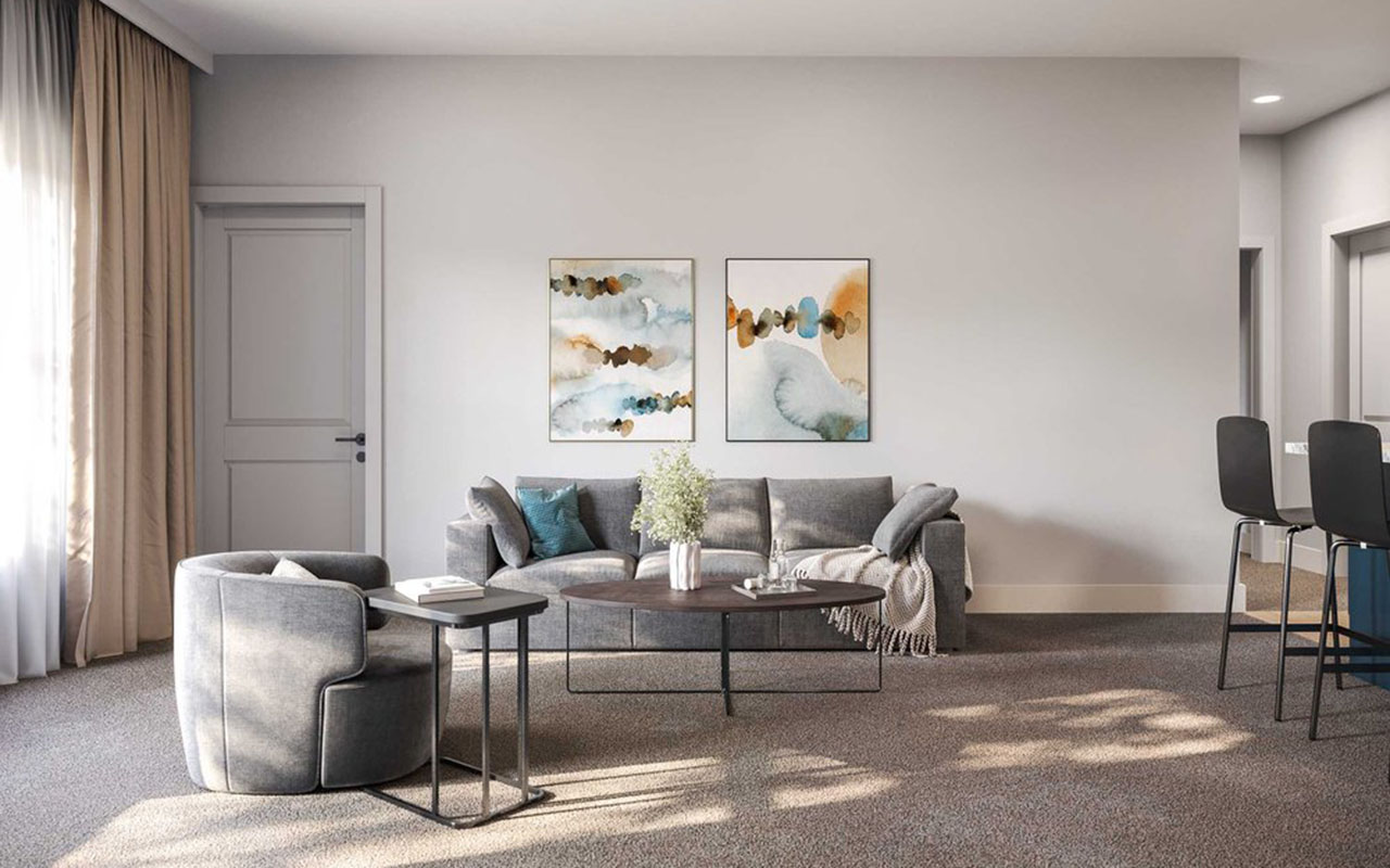 Apartment common area with sofa, chair and tables