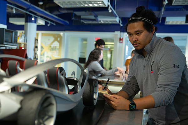 Co-op student working on car model design