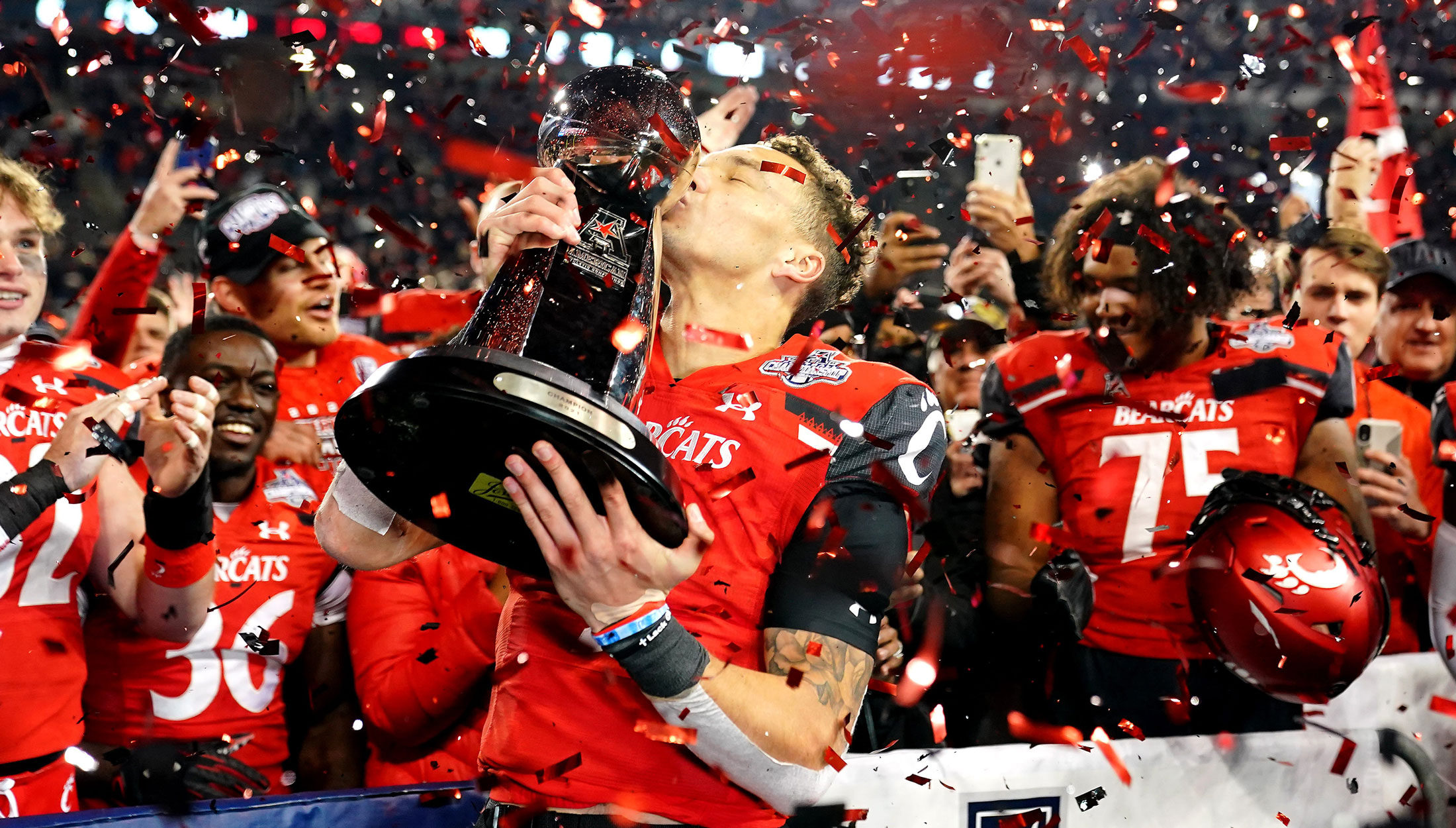 The University of Cincinnati Football Team celebrates a Conference Championship