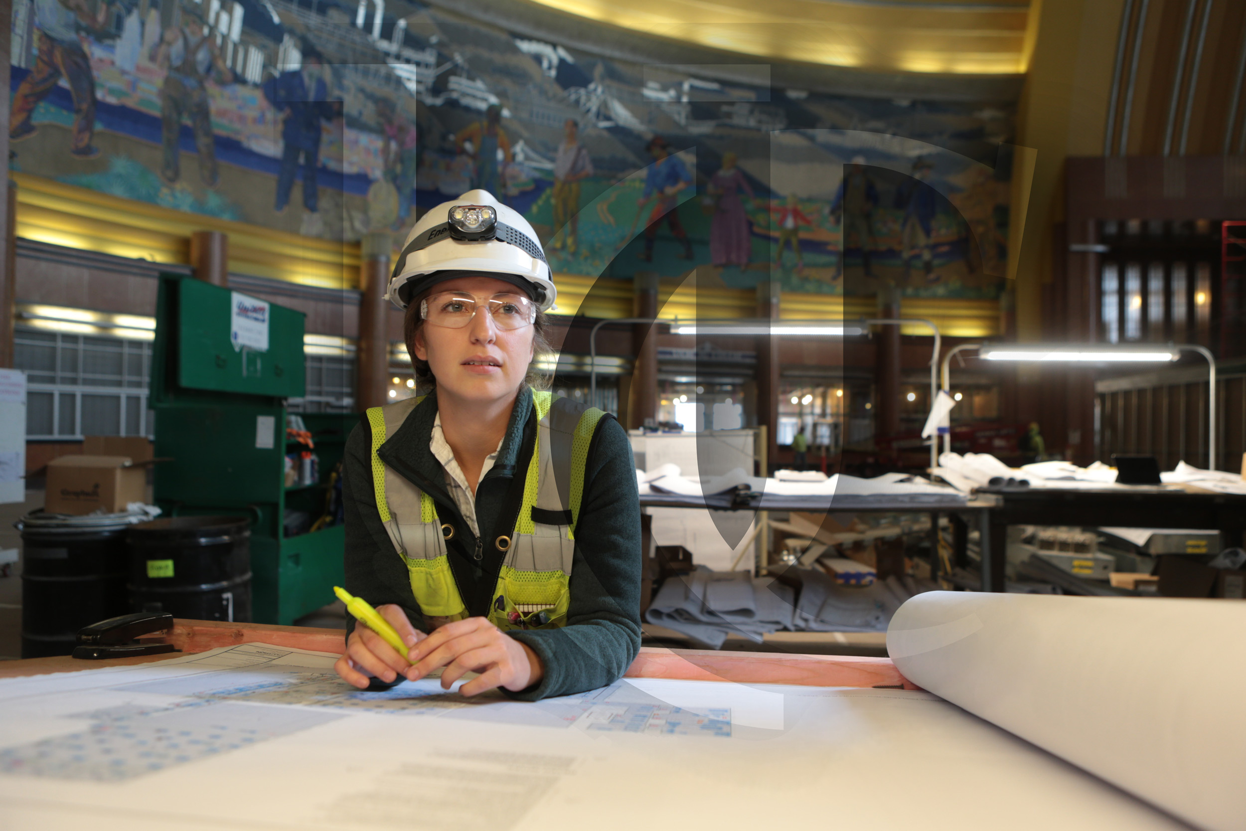 A co-op student looks over blueprints at Cincinnati's Union Terminal