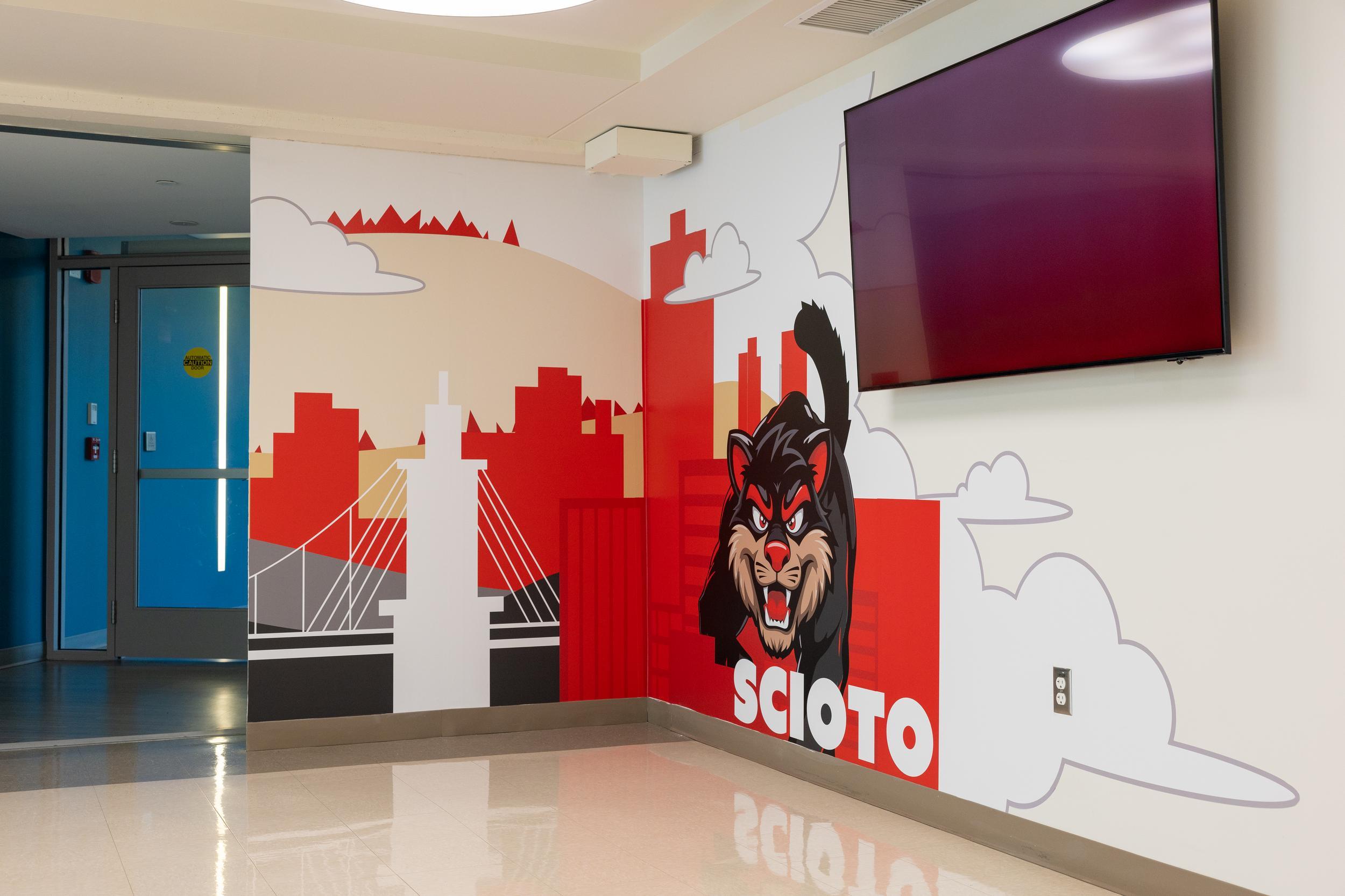 Mural of the UC bearcat and building images in Scito Hall