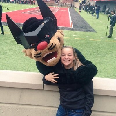 Goodwin with bearcat at football stadium