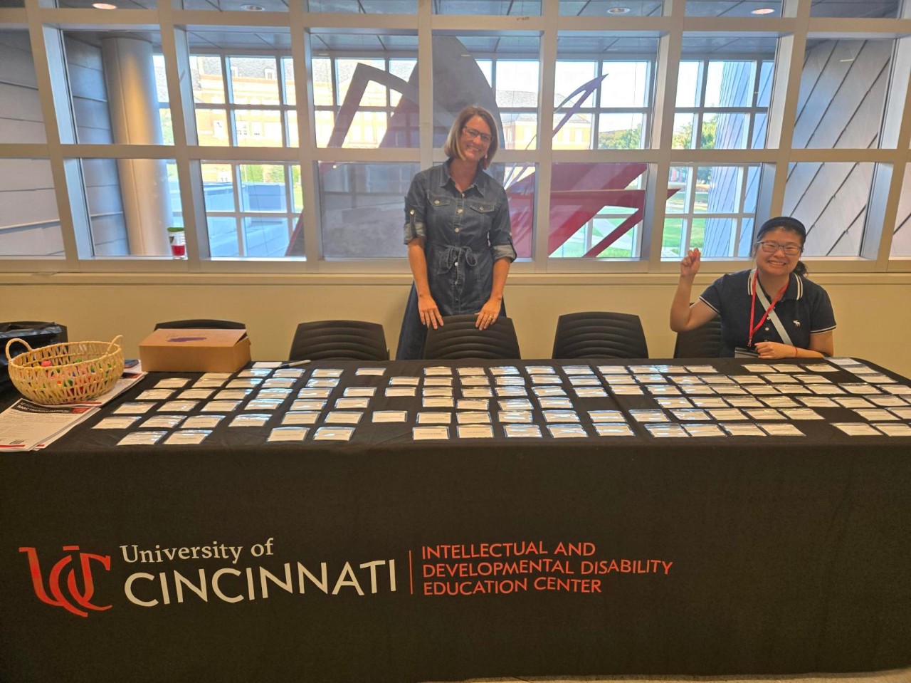 LEFT to Right: Registration table at RAAC Training Institute of Director, Sadie Everett and former TAP Graduate, Rachel Ma.